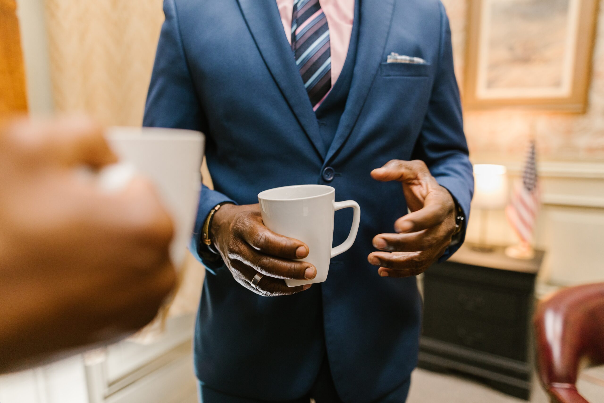 lawyer in suit holding coffee mug