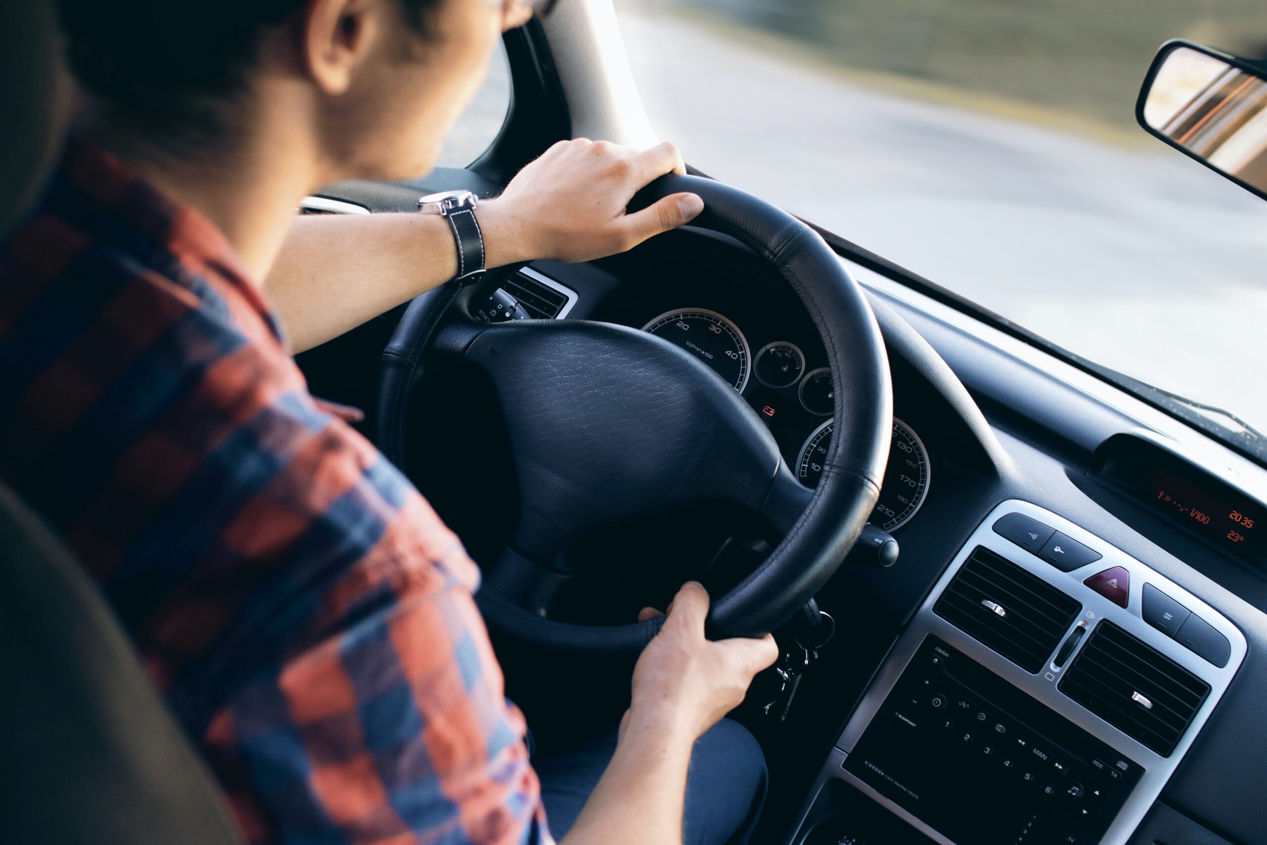 man driving car